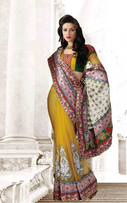Yellow embroidered net saree with blouse 1