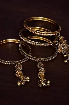 Gold Plated with Multiple Hanging Jhumkis, Bells  and Punjabi Kalire Styled Bangles