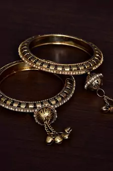 Gold Plated Zircon Stone and Seed Pearls Embellished Pair of Bangles with Hanging Bells