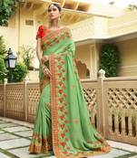 Green embroidered silk blend saree with blouse
