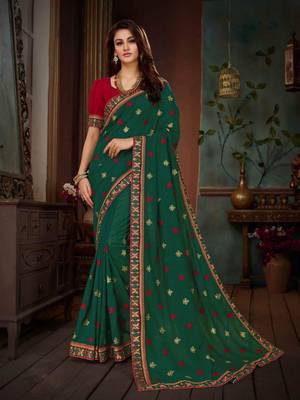Dark green embroidered art silk saree with blouse 1