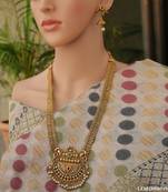 Golden traditional red, green stone studded copper necklace set