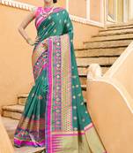 Green woven silk blend saree with blouse