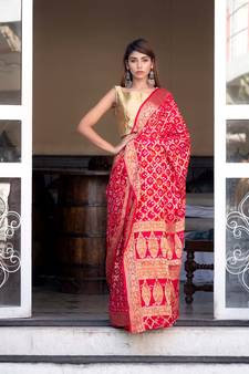 Red art silk saree with zari weaves and heavy pallu