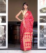 Red art silk saree with zari weaves and heavy pallu
