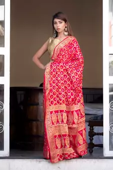 Red art silk saree with zari weaves and heavy pallu