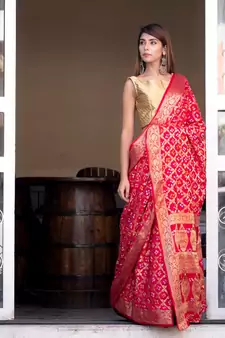 Red art silk saree with zari weaves and heavy pallu