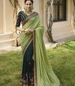 Dark green embroidered silk blend saree with blouse