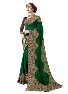 Dark green embroidered georgette saree with blouse 1