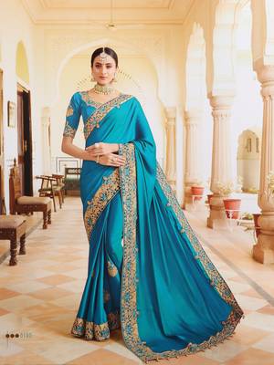 Turquoise embroidered silk saree with blouse 1