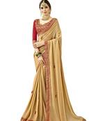 Beige embroidered georgette saree with blouse