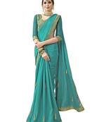 Turquoise embroidered shimmer saree with blouse