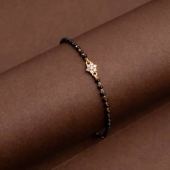 Black bead bracelet with diamond flower one gram gold 1