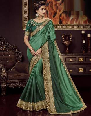 Green embroidered silk blend saree with blouse 1