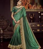 Green embroidered silk blend saree with blouse