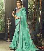Sea green embroidered satin saree with blouse