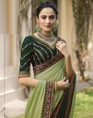 Green embroidered silk blend saree with blouse 4