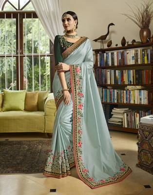 Light green embroidered silk blend saree with blouse 1