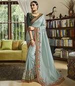 Light green embroidered silk blend saree with blouse