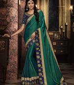 Green embroidered silk blend saree with blouse