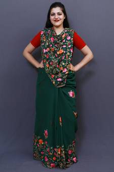 Bottle Green Colour Saree With Dense Aari Jaal On Pallu And Flowral Motifs.