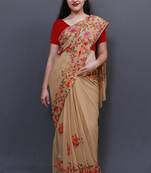 Elegant Fawn Colour Saree With Dense Aari Jaal On Pallu And Flowral Motifs.