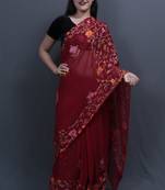 Maroon Colour Saree With Dense Aari Jaal On Pallu And Flowral Motifs.