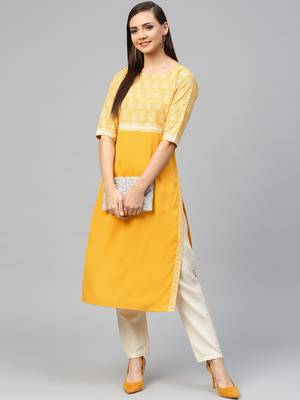 Yellow printed crepe kurtas-and-kurtis 5
