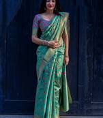 Green woven banarasi silk saree with blouse