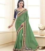 Green embroidered satin saree with blouse