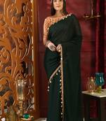 Dark green embroidered georgette saree with blouse