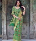 Green woven silk blend saree with blouse
