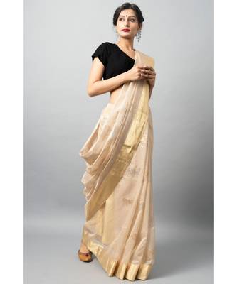 Stunning light biege hue with gold & silver zari work cow motifs and golden zari border 1