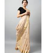 Stunning light biege hue with gold & silver zari work cow motifs and golden zari border