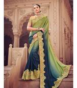 green embroidered satin saree with blouse