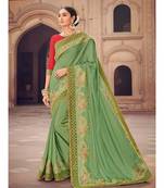 green embroidered satin saree with blouse