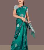 dark green woven art silk banarasi saree with blouse piece