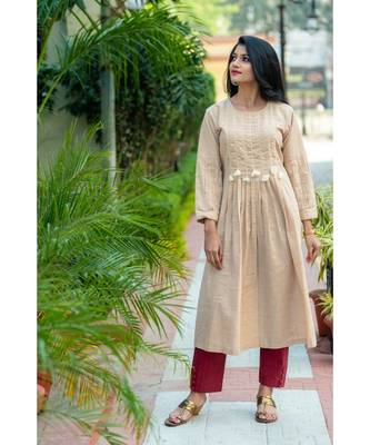 Beige coloured kurta with pearl work 1