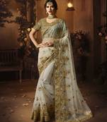 Off white embroidered net saree with blouse