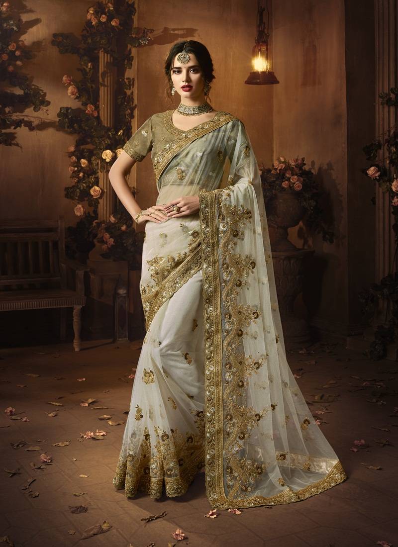 Off white embroidered net saree with blouse