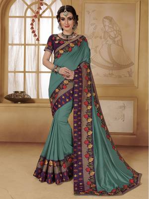 Turquoise woven faux chiffon saree with blouse 1