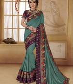 Turquoise woven faux chiffon saree with blouse