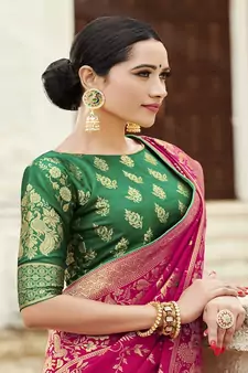 Magenta woven banarasi silk blend saree with blouse