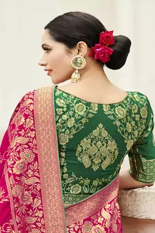 Magenta woven banarasi silk blend saree with blouse