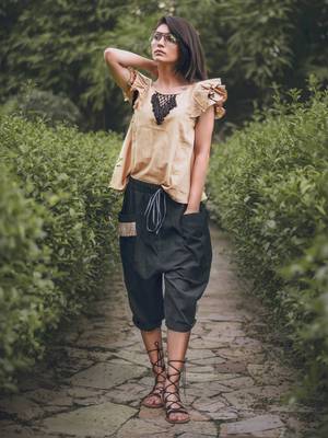 Low Crotch Black Baggy Pant With Beige Top 1