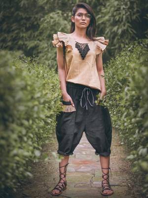 Low Crotch Black Baggy Pant With Beige Top 2