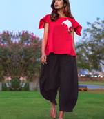 Red Top And Black Baggy Pants Pair