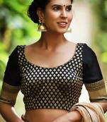 Black and gold brocade blouse with raw silk sleeves and gold bead edging