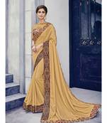 golden embroidered silk blend saree with blouse