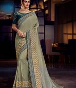 Olive embroidered satin saree with blouse